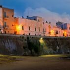 Panoramic sunset view of Gallipoli old city and sea, Apulia, Italy Von jekatarinka